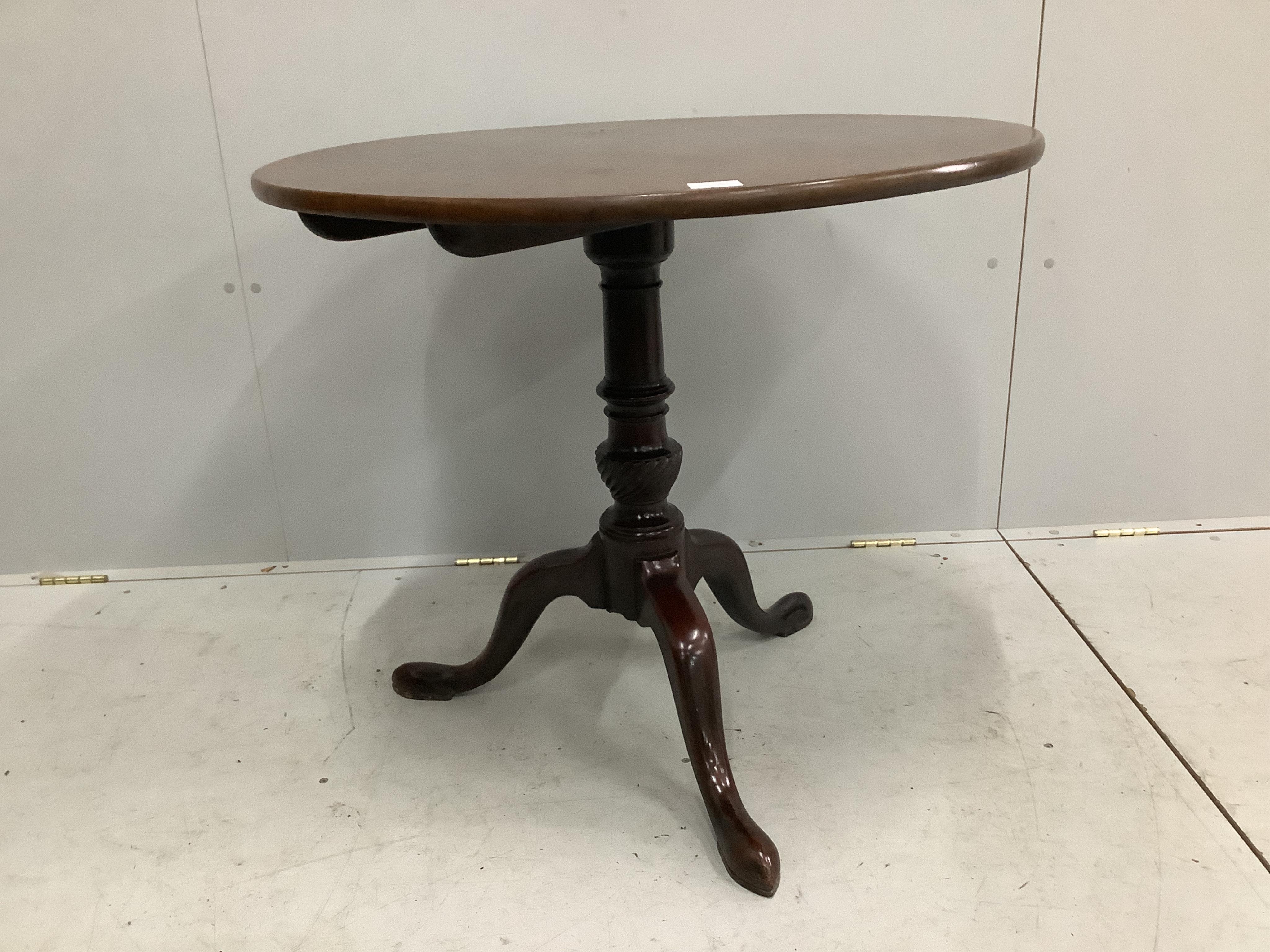 A George III circular mahogany tilt-top tripod tea table, diameter 82cm, height 71cm. Condition - fair